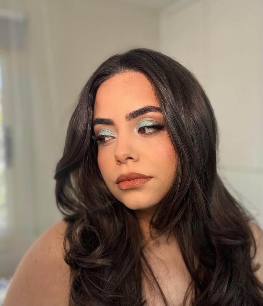 Soft glam evening makeup with lifted lashes and a glossy nude lip